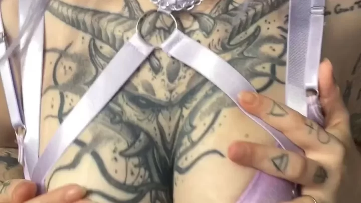 Tattooed girl in lavender lingerie plays with herself