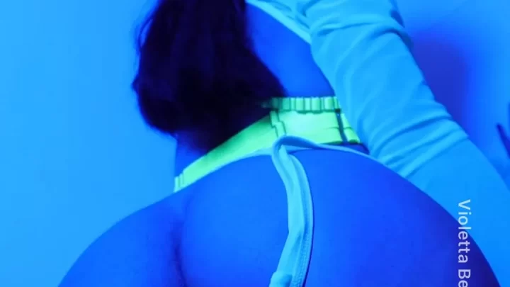 Brunette bends over in blue lit underwear