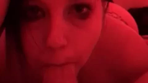 Brunette girl with face tattoos lies down