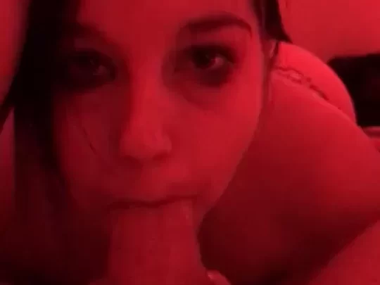 Brunette girl with face tattoos lies down