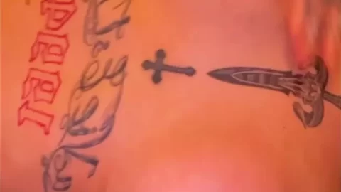Tattooed White Girl Exposes Breasts, Plays with Nipple Piercings