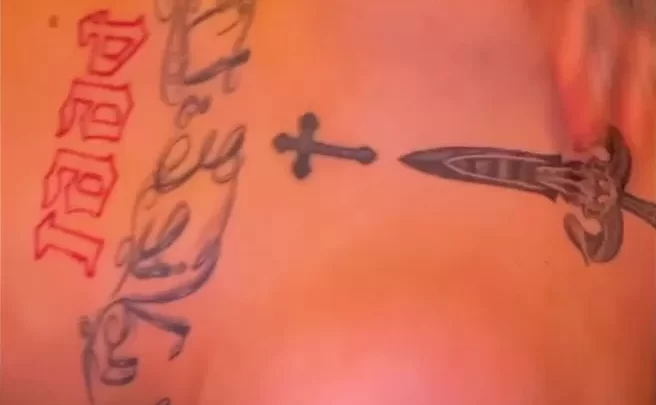 Tattooed White Girl Exposes Breasts, Plays with Nipple Piercings