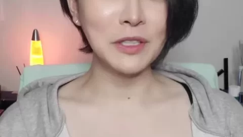 Petite Asian girl talks and strips