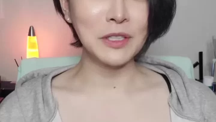 Petite Asian girl talks and strips