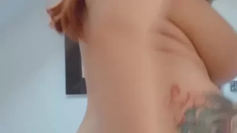 Redhead with Tattoos Poses Naked