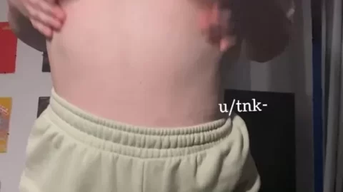 Blonde girl plays with her breasts