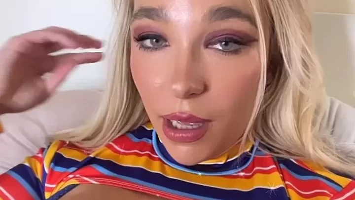Blonde girl with nipple piercing fucks herself on bed