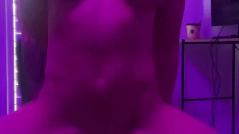 Blonde girl plays with herself under neon light