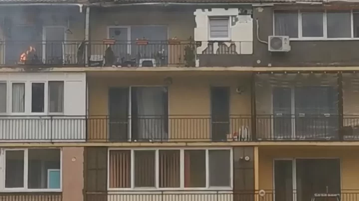 apartment building fire truck on fire daytime