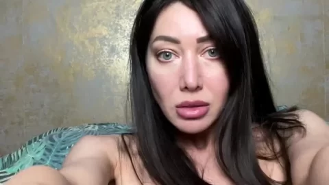 Asian girl uses speculum for self-exam