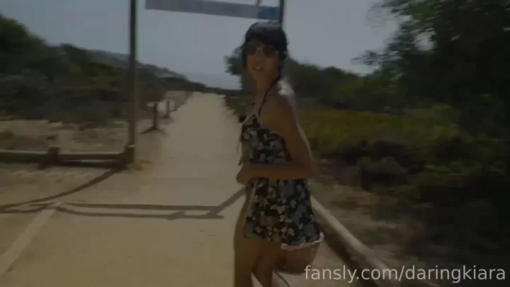 Slim white girl with tattoo walks and poses outdoor