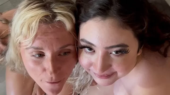 Blonde and brunette girls with tattoos give each other a blowjob