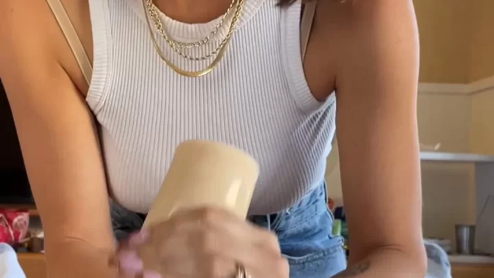 Brunette applies lube to toy, teases guy