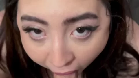 Petite Asian girl plays with toy