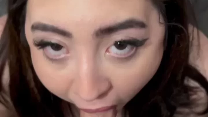 Petite Asian girl plays with toy