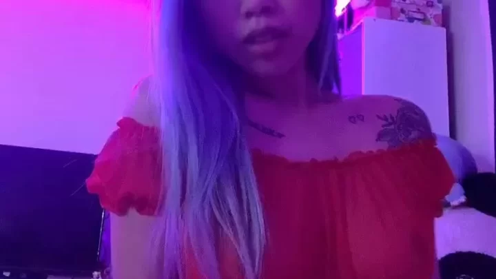 Asian girl with tattoos fucks herself on bed