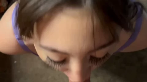 Asian chick gives white guy blowjob, gets handjob